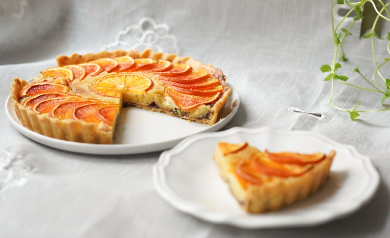 Seasonal fruit tart with custard and fresh berries